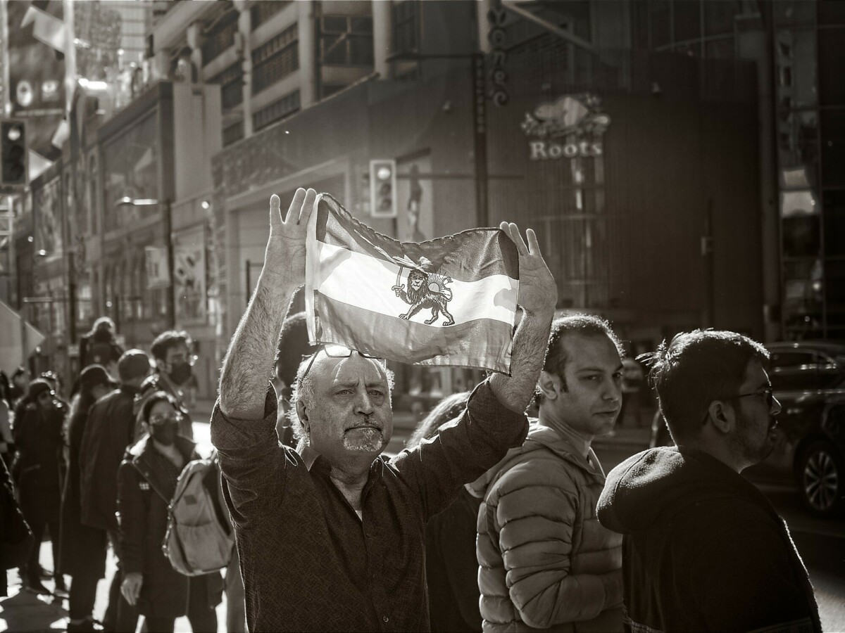 Protestor With Iranian Flag