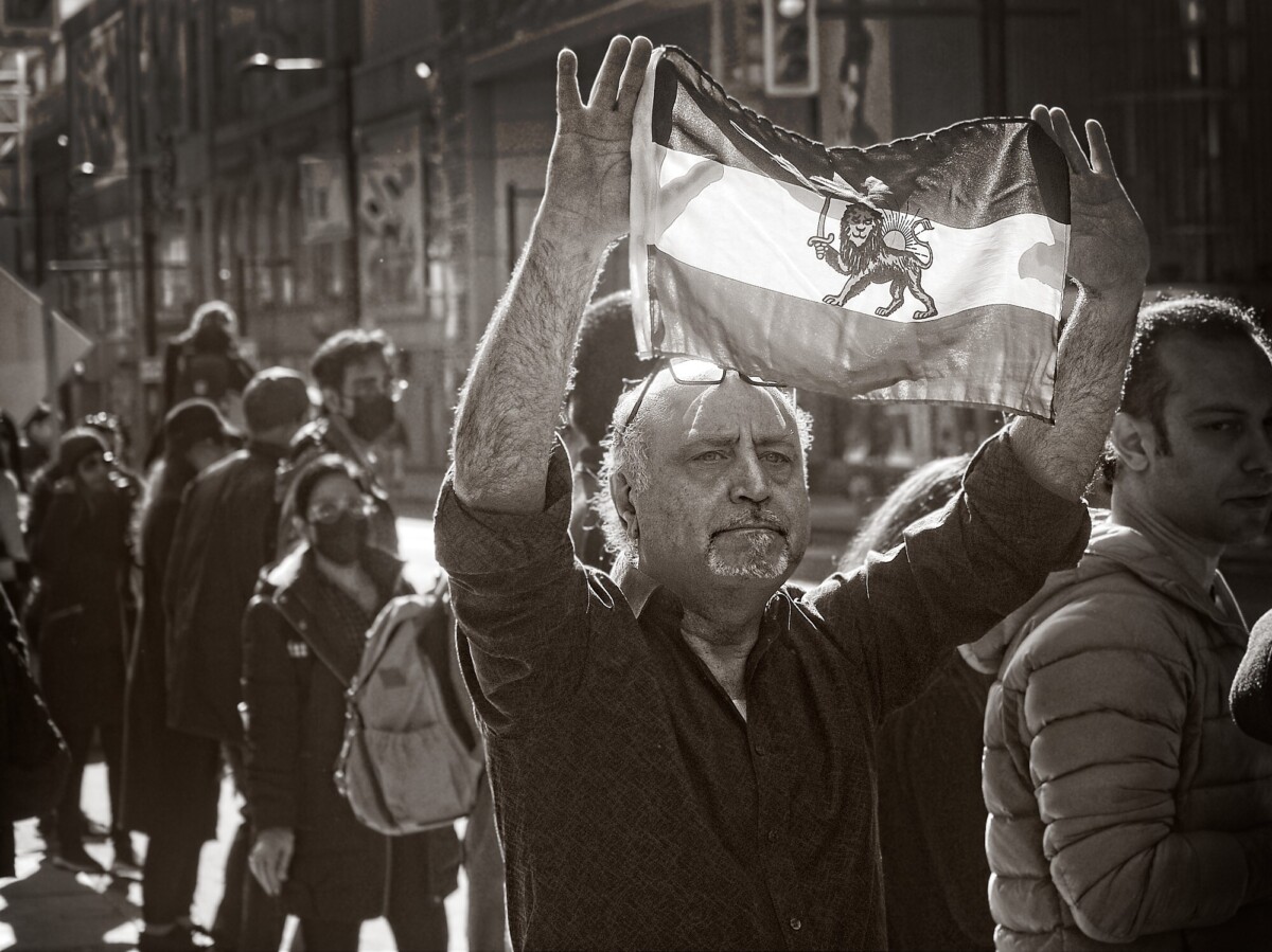 Protestor With Iranian Flag